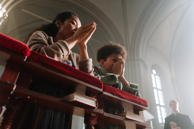 People praying in a church setting.