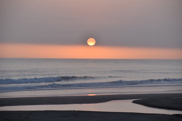 a sunset over a beach
