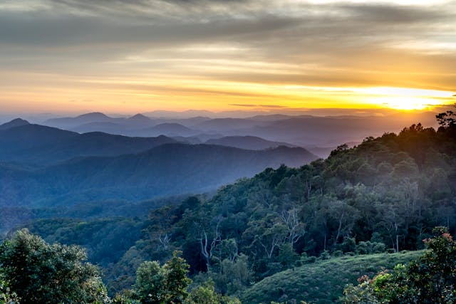 a sunset over a mountain range