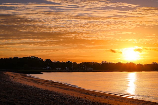 a sunset over a beach