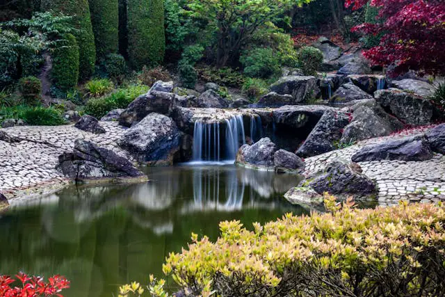 Serene garden with waterfall and pond