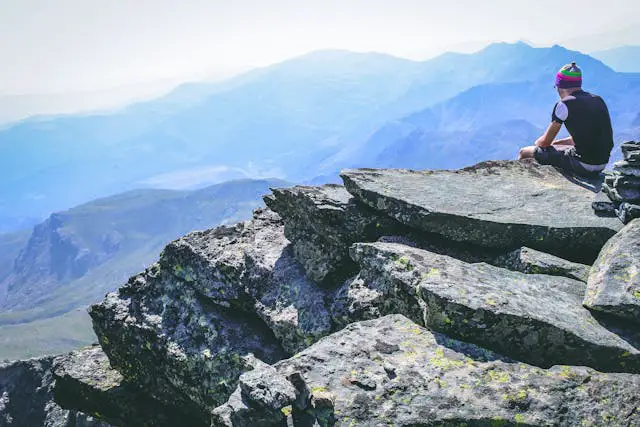 a person standing on a rock