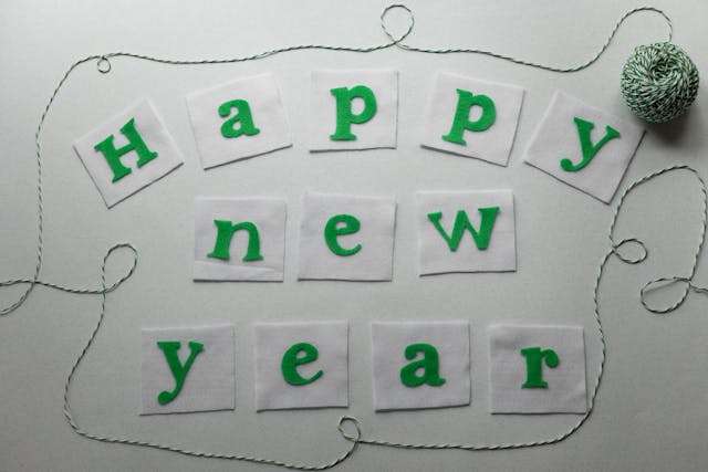 Green letters spell Happy New Year