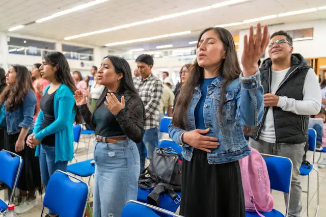 People standing in a gathering.