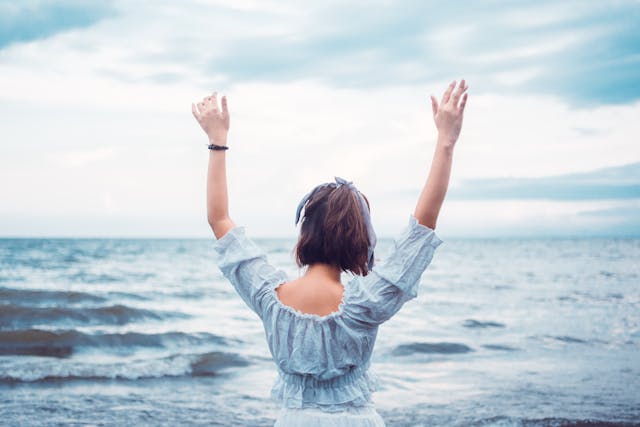 Person enjoying the beach view.