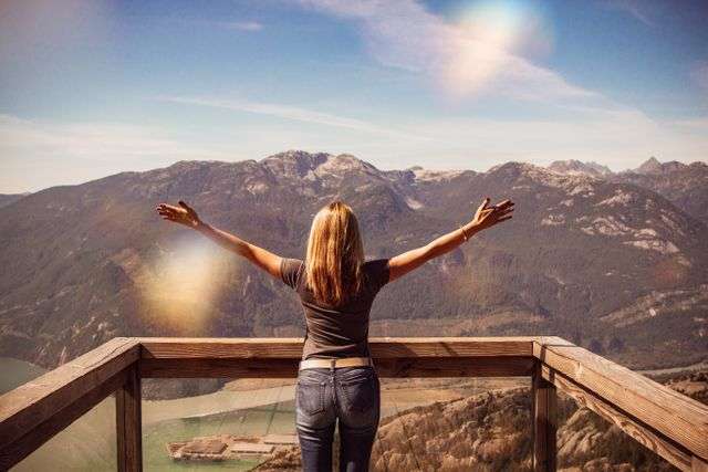 Person enjoying a scenic mountain view