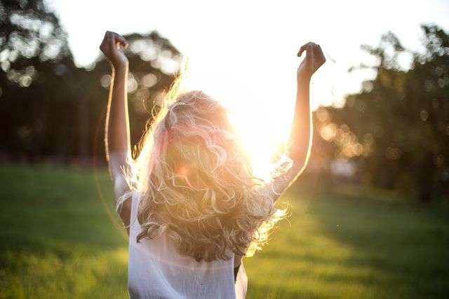 Girl enjoying sunset in nature