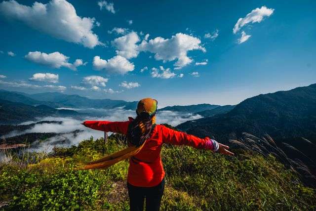 Person enjoying a scenic mountain view