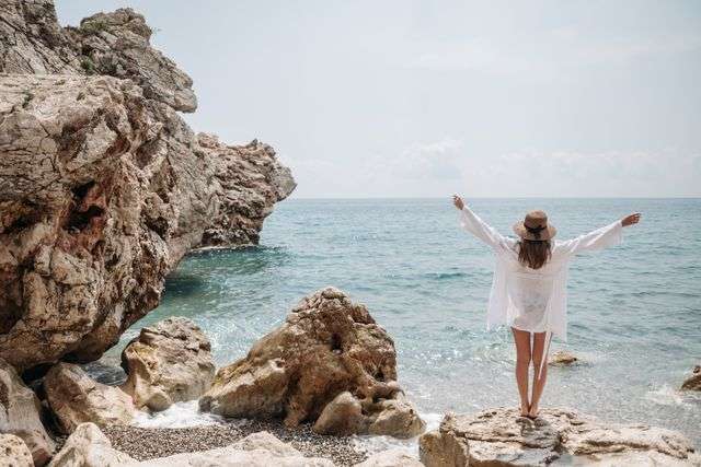 Person enjoying a serene beach view
